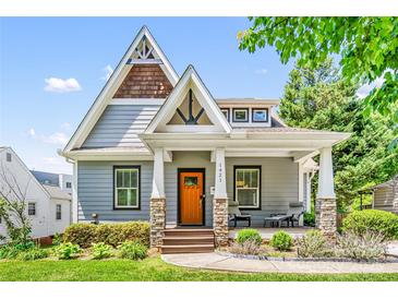 Charming home featuring a peaked roof, craftsman pillars, and a welcoming front porch at 1421 Lyon Ct, Charlotte, NC 28205