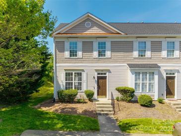 Charming townhome featuring a well-maintained facade, front lawn, and welcoming entrance at 542 Goldstaff Ln, Charlotte, NC 28273