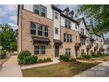 Charming townhomes featuring brick and siding accents, landscaped yards, and inviting curb appeal at 604 Tudor Park Way, Charlotte, NC 28211