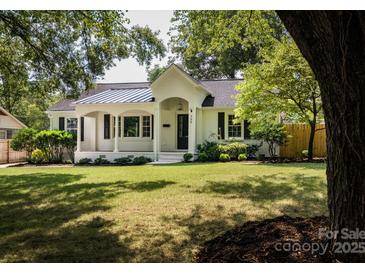 Charming renovated home with a manicured lawn and inviting front porch at 754 Wriston Pl, Charlotte, NC 28209