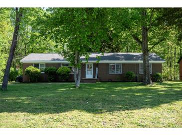 Charming single-story brick home with a lush green lawn and mature trees offering ample shade at 438 Starcrest Cir # C, Rock Hill, SC 29730