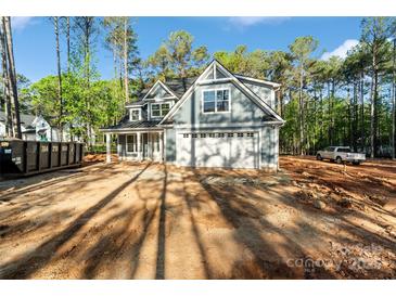 New construction home featuring light blue siding, white trim and a two-car garage on a spacious lot at 925 Twin Lakes Rd, Rock Hill, SC 29732