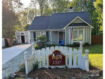 Charming single-Gathering home with a well-maintained lawn, picket fence and pleasant curb appeal at 11137 Atrium Way, Matthews, NC 28105
