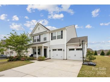 Charming two-story home featuring a two-car garage and a well-manicured front yard at 1218 Juddson Dr, Waxhaw, NC 28173