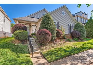 Charming home featuring mature landscaping and a welcoming front entrance with decorative shrubs at 3939 Archer Notch Ln, Huntersville, NC 28078