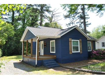 Charming blue home featuring a covered porch with wooden columns and shutters at 510 Belmont Mount Holly Rd, Belmont, NC 28012