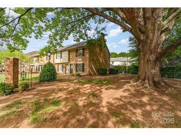Charming townhome with brick facade and mature tree providing ample shade at 3726 Park Rd, Charlotte, NC 28209