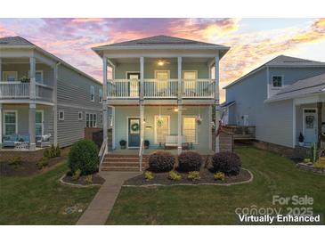 Inviting two-story home featuring double porches and manicured landscaping at 507 E Main St, Rock Hill, SC 29730