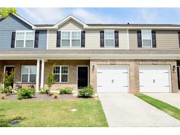Charming townhome with a well-manicured lawn and attached garages at 525 San Marco Dr, Gastonia, NC 28056