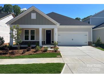 Charming single-Gathering home with a two-car garage, manicured lawn, and craftsman-style details at 606 Banter Ln # 30, Cramerton, NC 28032