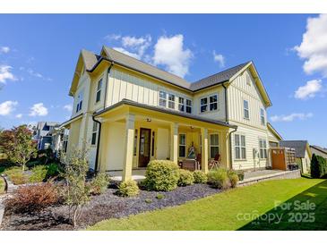 Charming two-story home featuring a welcoming front porch and well-maintained landscaping at 1507 Riverwalk Pkwy, Rock Hill, SC 29730