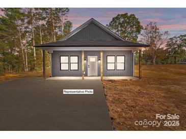 Charming single-story home with welcoming front porch and modern design elements at 15700 Stokes Ferry Rd, Richfield, NC 28137