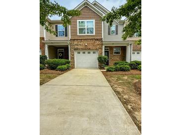 Charming townhome with a brick facade and a one-car garage at 2752 Sawbridge Ln, Gastonia, NC 28056