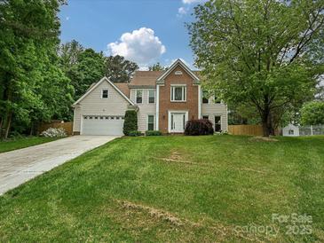 Charming two-story home with a well-manicured lawn and inviting front entrance at 3612 Woodnotch Ct, Charlotte, NC 28269