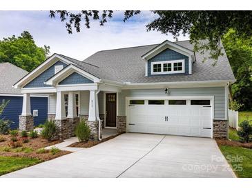 Charming craftsman home featuring stone accents, a two-car garage, and inviting curb appeal at 604 Banter Ln # 29, Cramerton, NC 28032