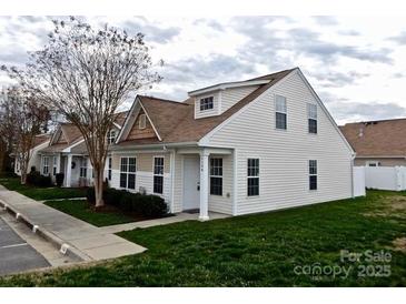 Charming two-story home with white siding and a well-manicured lawn at 1156 Fowler Brook Ct, Indian Land, SC 29707