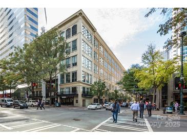 Attractive multi-story building exterior showing streetscape with sidewalks and street crossings in an urban setting at 127 N Tryon St # 511, Charlotte, NC 28202