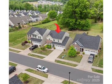 Charming home features well-manicured landscaping and a two-car garage in a desirable neighborhood at 176 Jennymarie Rd, Mooresville, NC 28115