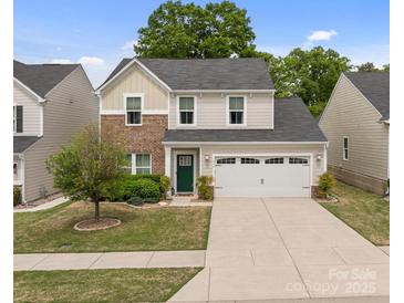 Charming two-story home featuring a well-manicured lawn, a two-car garage, and a welcoming front door at 176 Jennymarie Rd, Mooresville, NC 28115