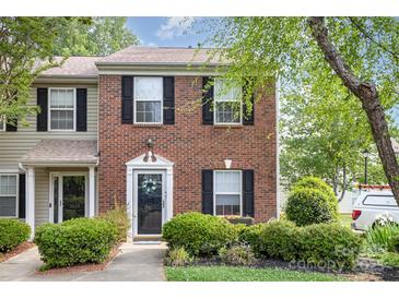 Charming two-story brick home with well-maintained landscaping and black shutters at 5257 Glenlea Walk Ln, Charlotte, NC 28216
