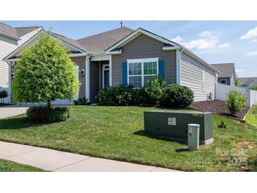 Charming home featuring well-maintained landscaping and vibrant green lawn at 170 Atwater Landing Dr, Mooresville, NC 28117