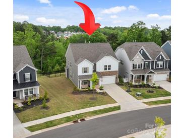 Charming two-story home with a well-maintained lawn and attractive landscaping at 190 Tetcott St, Mooresville, NC 28115