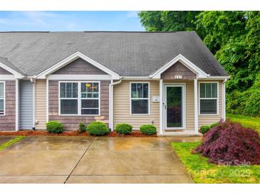 Charming single-story home with a well-manicured lawn and inviting facade at 117 S Canyon Ridge S Dr, Mount Holly, NC 28120