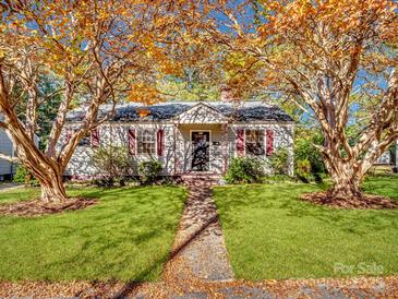 Charming single story home with beautiful trees, well-maintained lawn, and inviting walkway at 412 Keels Ave, Rock Hill, SC 29730