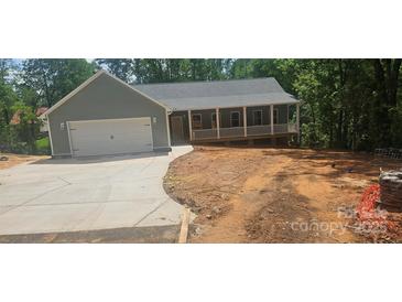 Charming home with a two-car garage and welcoming front porch at 532 Robinhood Rd # 27, Maiden, NC 28650