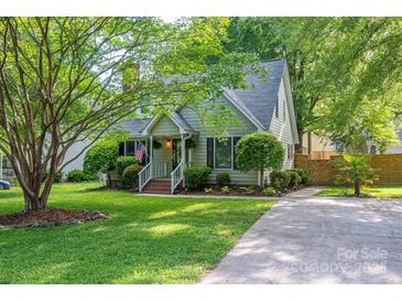 Charming single-story home featuring mature trees, landscaped yard, and inviting front porch at 741 Bermuda Ave, Gastonia, NC 28054