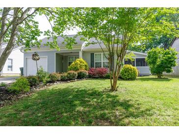 Charming home featuring a well-manicured front yard and lush landscaping at 1455 Fieldcrest Cir, Rock Hill, SC 29732