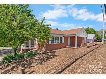 Charming brick home with a well-maintained lawn and inviting curb appeal at 3015 North Center Nw St, Hickory, NC 28601