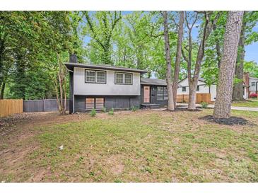 Charming two-story home with a modern black and grey exterior and landscaped front yard at 3619 Bankston Pl, Charlotte, NC 28215