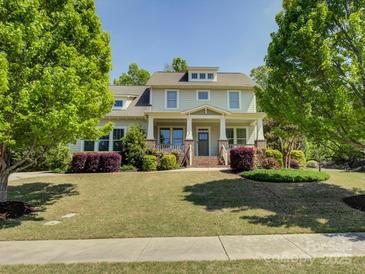 Charming two-story home with landscaped front yard and inviting porch at 1222 Kings Bottom Dr, Fort Mill, SC 29715