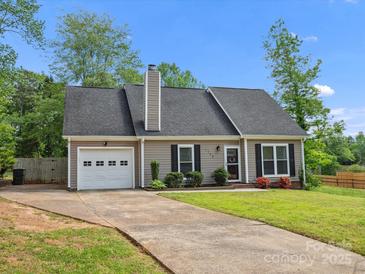 Charming single-story home with a driveway, garage and well-maintained lawn at 1758 Bridlewood Ct, Gastonia, NC 28054