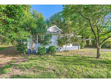 Charming single-story home with mature trees and grass at 828 Richard Ave, Kannapolis, NC 28081