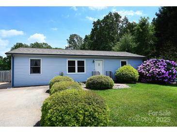 Charming single-story home with a well-maintained lawn and beautiful landscaping at 2263 Starbrooke Dr, Newton, NC 28658