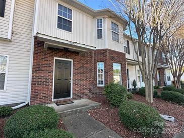 Charming brick townhome with a well-maintained front yard and inviting entrance at 4143 Kenton Glenn Nw Ct, Concord, NC 28027