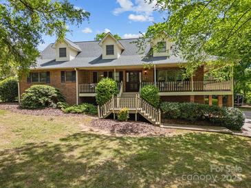 Charming two-story brick home with dormers and a welcoming front porch at 627 S Chapel St, Landis, NC 28088