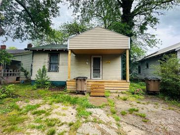 Modest, one-story home with a covered front porch and a compact yard, presenting an opportunity for renovation at 714 Douglas St, Shelby, NC 28150