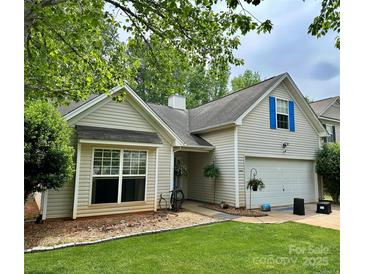 Charming single-story home with vinyl siding, an attached garage, and a well-maintained lawn at 1863 New Castle Dr, Fort Mill, SC 29707