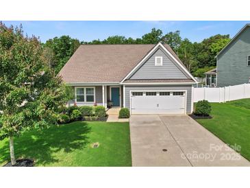 Charming single Gathering home with well-manicured lawn and attached two-car garage at 2124 Katie Alice Cir, Waxhaw, NC 28173