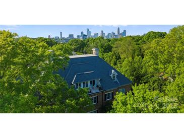Stunning home with lush landscaping and beautiful views of the Charlotte skyline at 974 Queens Rd, Charlotte, NC 28207