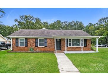 Charming brick ranch-style home with a well-manicured front yard and inviting covered porch at 1204 Glenarden Dr, Rock Hill, SC 29730