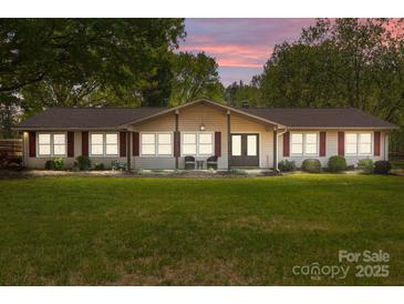Charming one-story home with a well-manicured lawn, inviting entrance, and plenty of natural light at 6325 Yount Dr, Salisbury, NC 28147