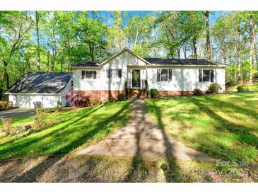 Charming home featuring a well-maintained front yard and a classic exterior design at 118 Taylor Ct # 16, Mooresville, NC 28117