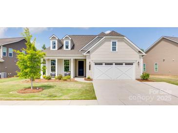 Charming single-Gathering home with a two-car garage, manicured lawn, and inviting front porch at 3029 Trace Meadow Ct, York, SC 29745