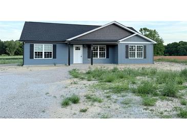 Charming single-story home featuring a new roof, attractive siding, and a well-manicured lawn at 4044 Hurley Walters Rd, Lancaster, SC 29720
