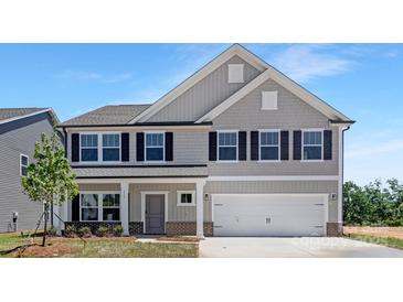 Charming two-story home featuring gray siding, black shutters, and a two-car garage at 111 Stonewater Dr # 25, Red Cross, NC 28129