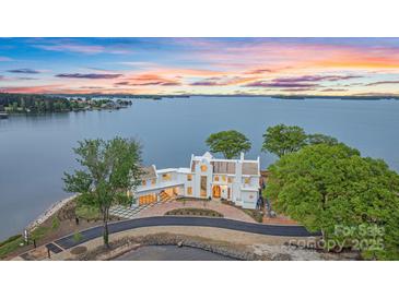 Stunning waterfront home with lake views and lush landscaping at 8397 Ranger Island Marina Rd, Denver, NC 28037